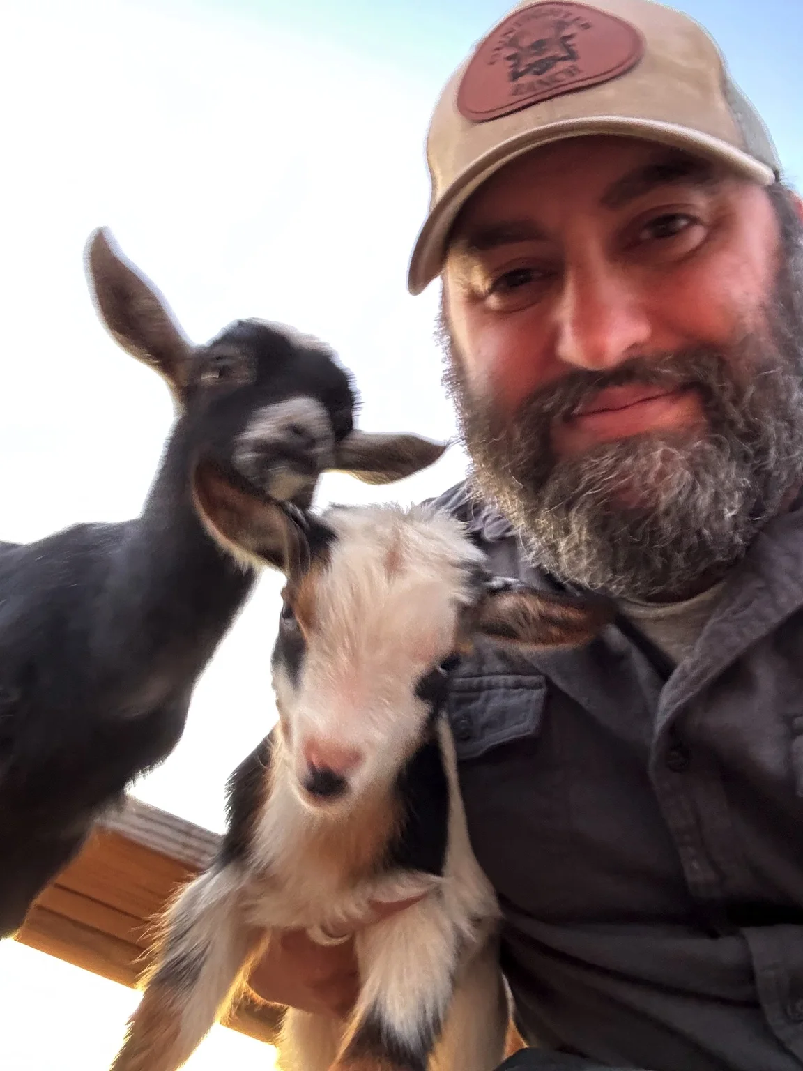 Steve with two young goats at Gunfighter Ranch